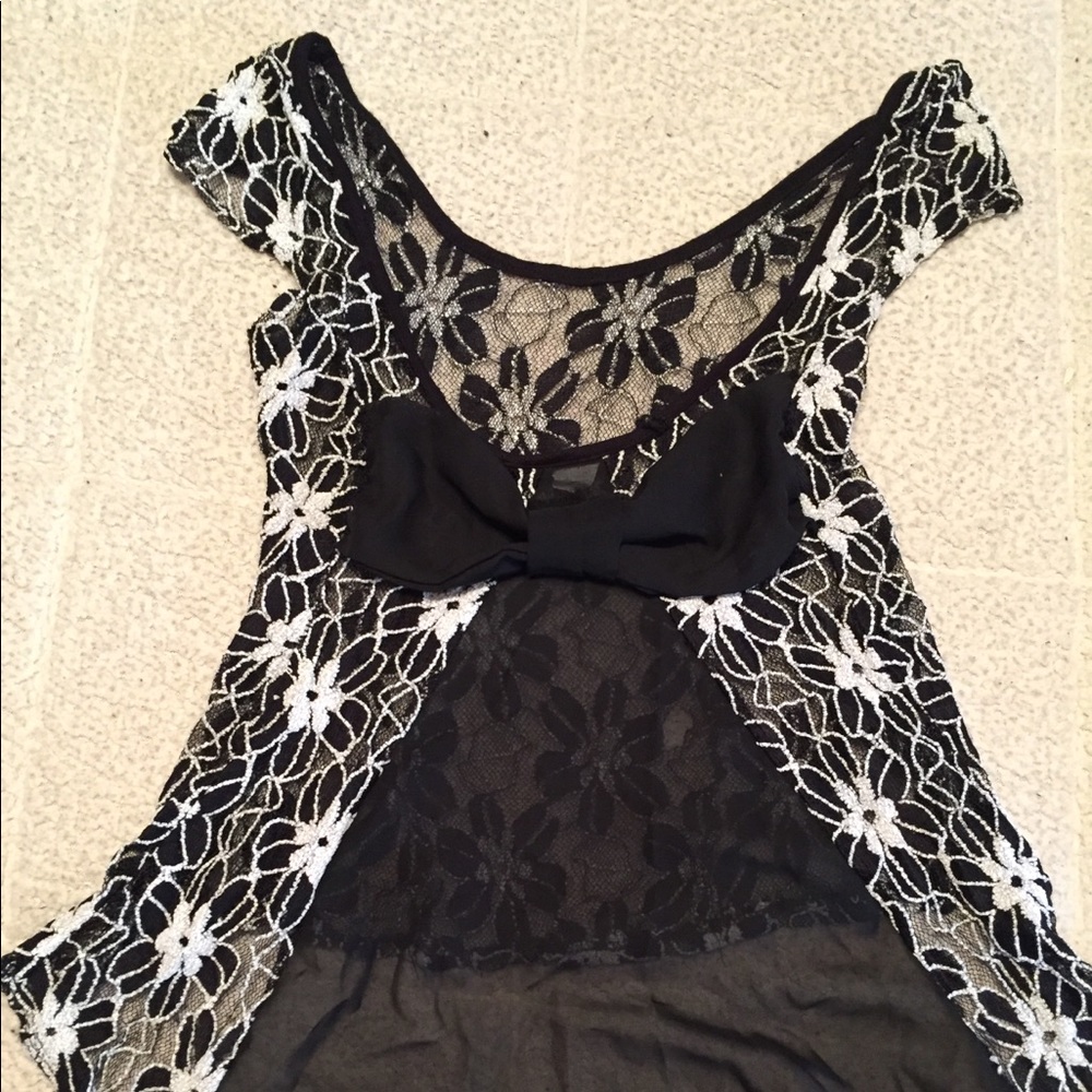 Lace top with bow detail on back. Size medium